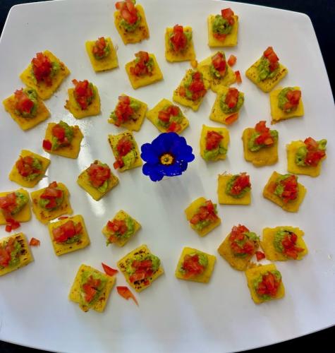 Polenta with tomatoes and guacamole