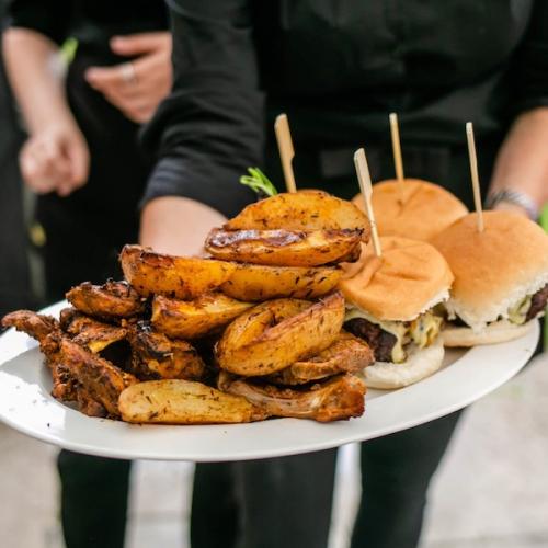 BBQ platter of burgers, chicken and cajun potato wedges